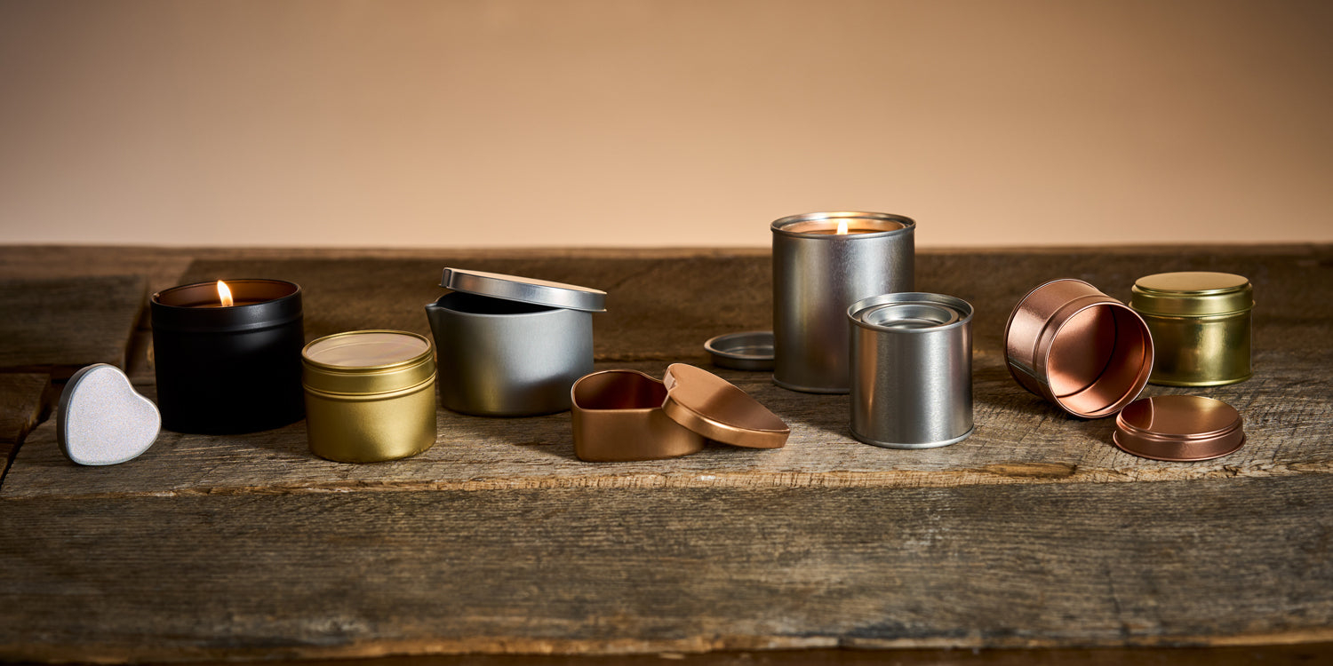 candle tins on a wood block