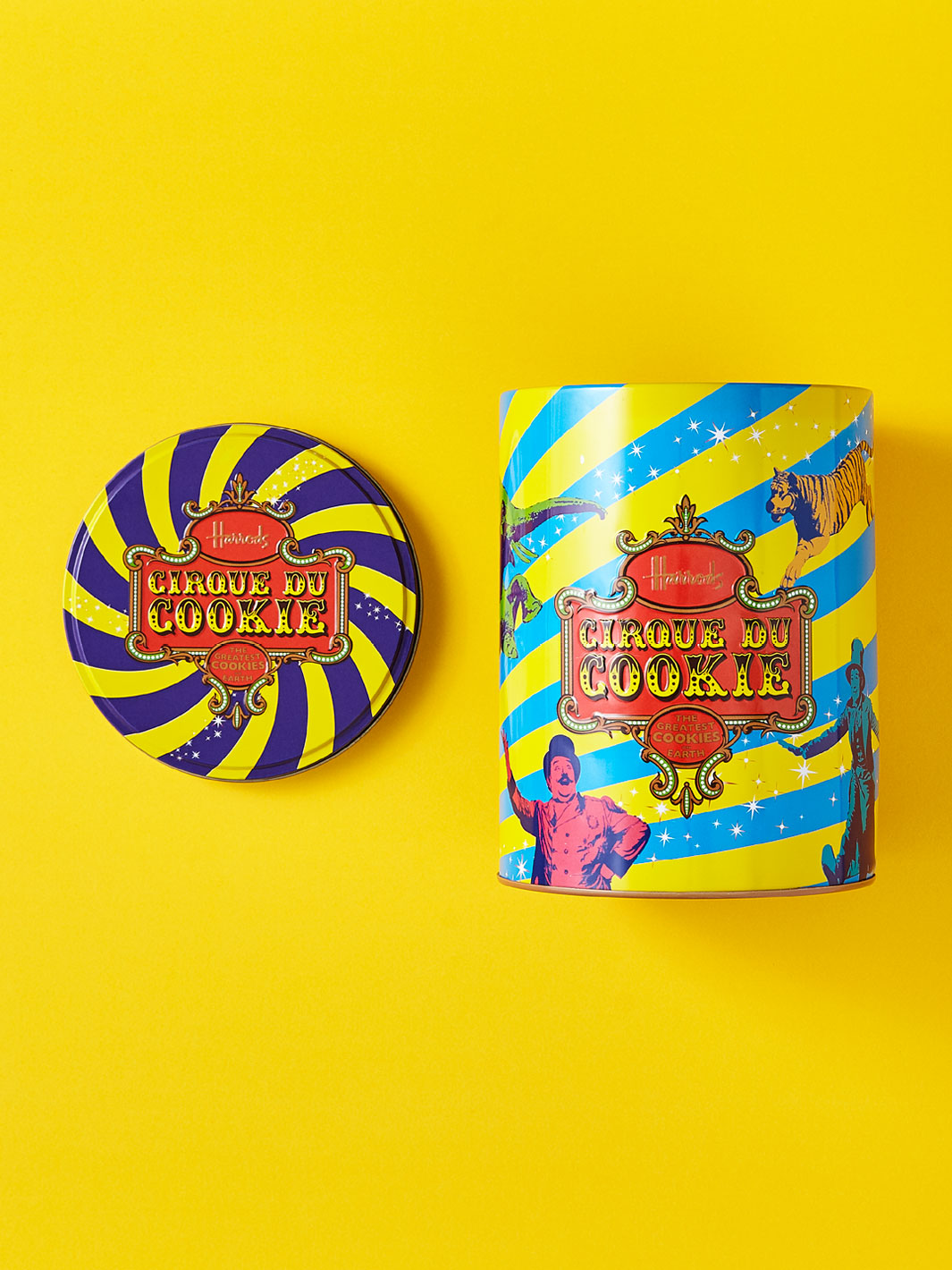 Metal cookie packaging on a yellow background.