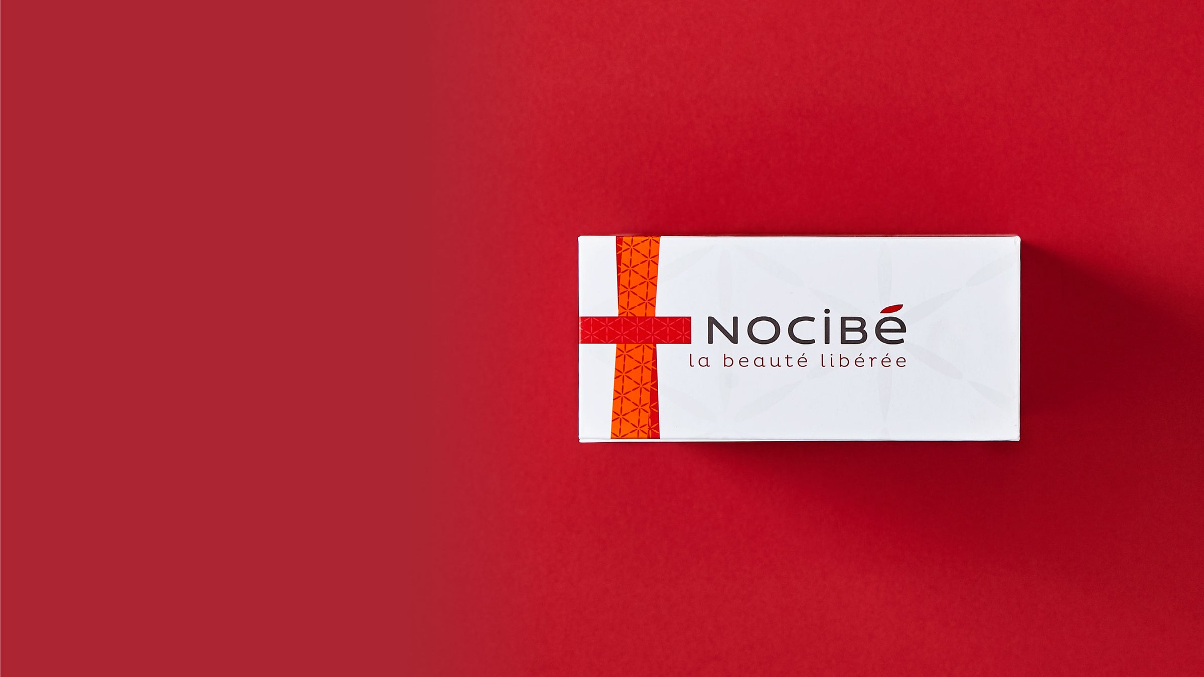 Custom luxury cardboard packaging on a red background